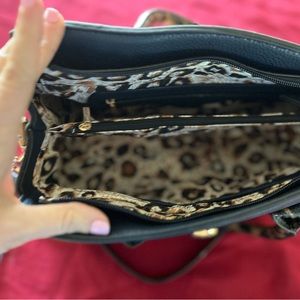 Navy blue purse with leopard on handles and lower portion purse